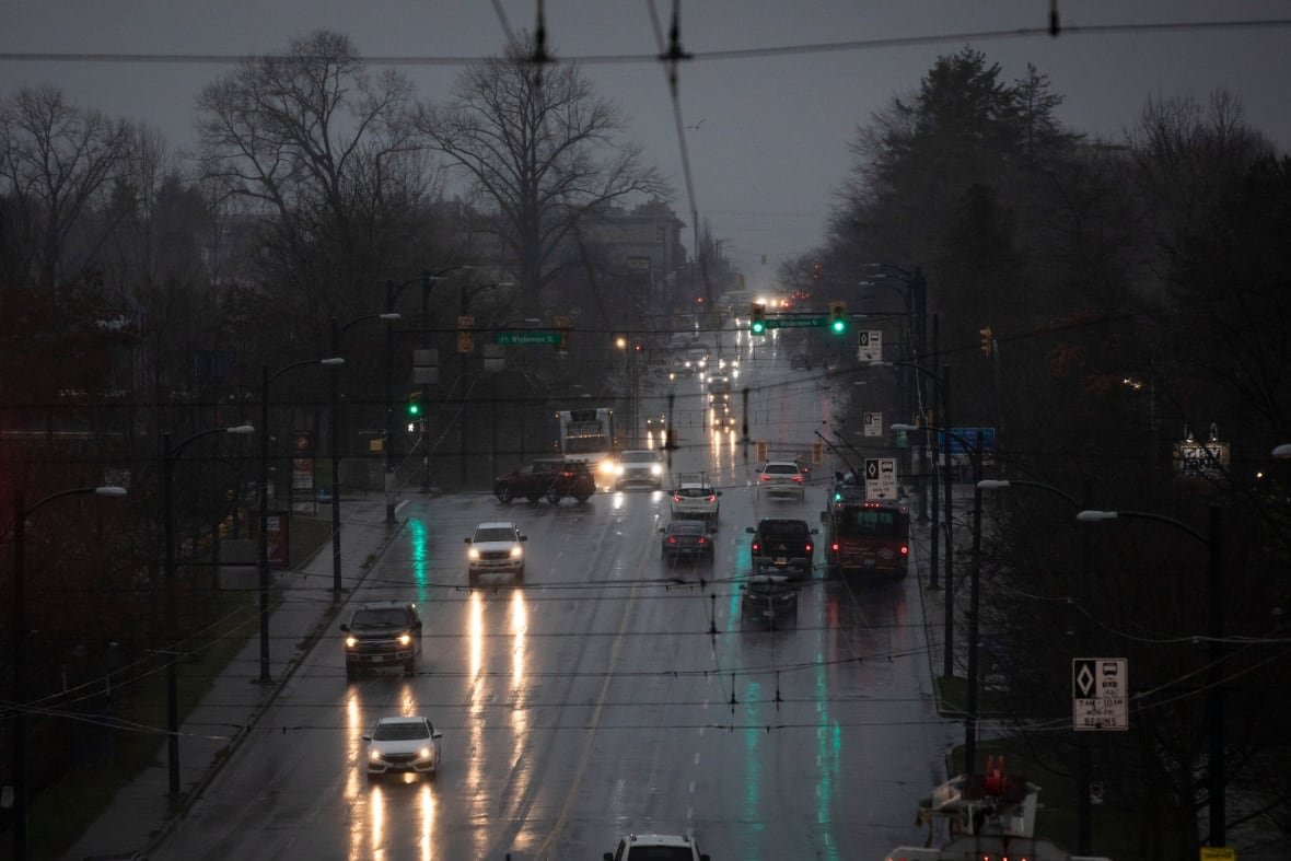atmoshperic-river Cars and buses share the road during a period of significant rain.