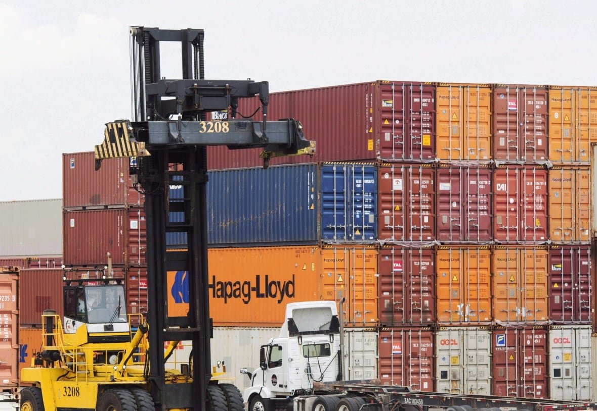 boating-blockchain-20181025 Containers are unloaded at the Port of Montreal in Montreal on July 20, 2017. The Canada Border Services Agency and the Port of Montreal are dipping their feet into a blockchain-powered technology that aims to streamline freight shipping and cut costs. In a trial run, the federal customs agency and the country's second-biggest port have signed on to the digital database -- a distributed ledger that shares and syncs up data from carriers, ports and wholesalers in places from Singapore to Peru.