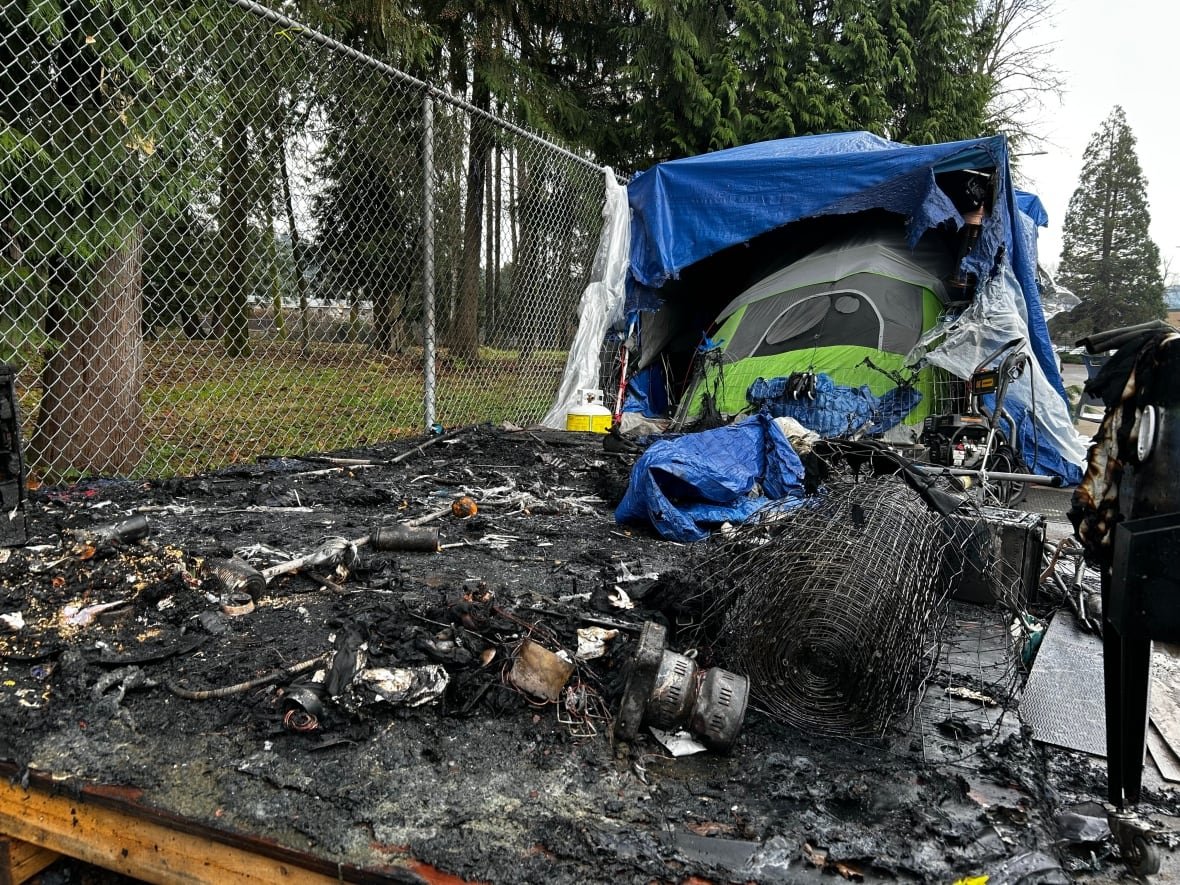 coquitlam-tent-encampment-burned-platform Charred remains of a tent and wooden platform.