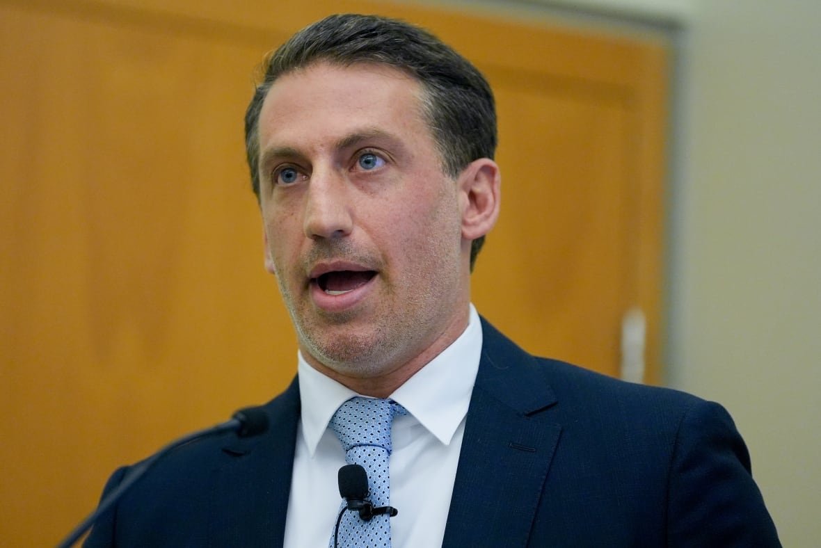 nyc-mayor-investigations A person with a microphone clipped to their tie is seen speaking.