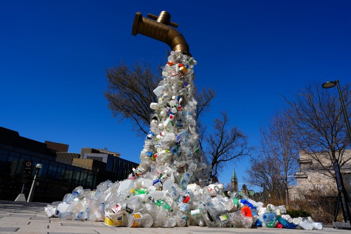 plastics-pollution-20240422-1 giant plastic tap art installation