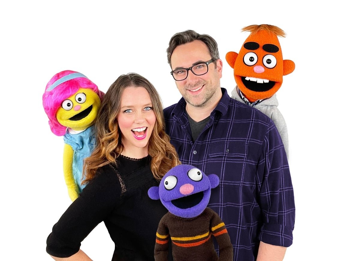 pancake-manor Two people pose with puppet.