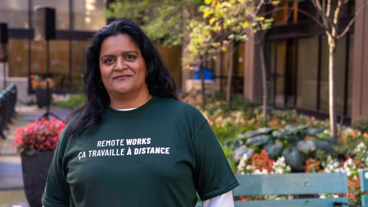 sharon-desousa-psac A union executive at an outdoor rally in summer. Her shirt says 'Remote works.'