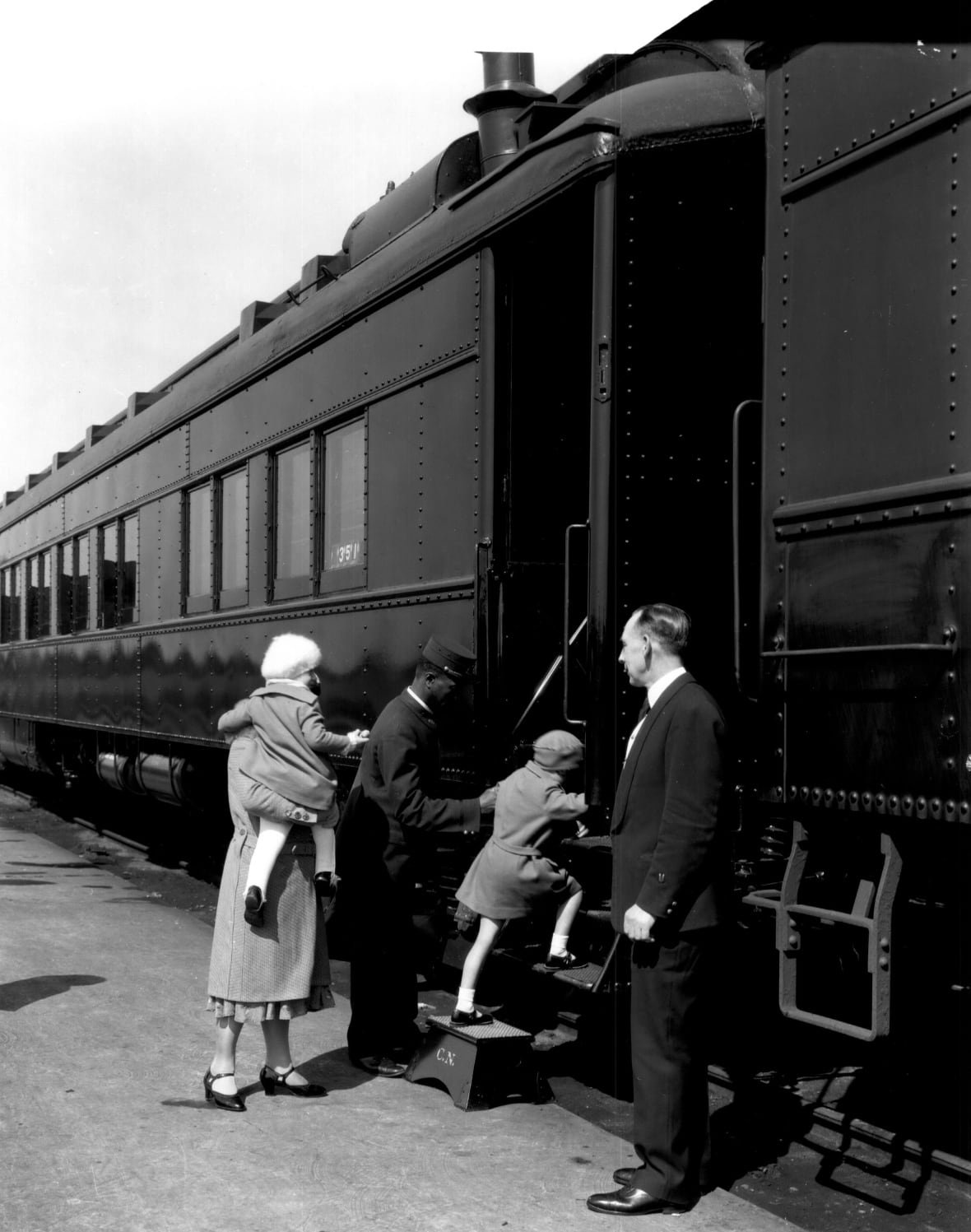 sleeping-car-porters-archival-photo Black and white photo shows people getting on a train