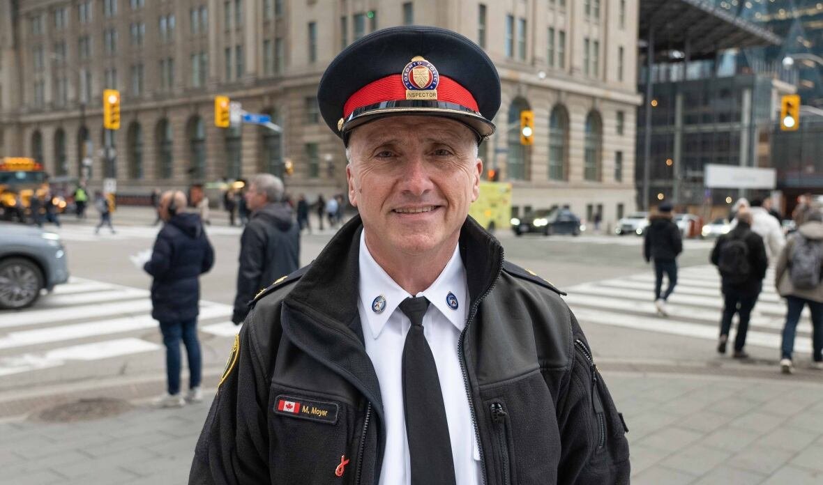 acting-supt-matt-moyer-tps-traffic-services Police officer standing in front of Toronto intersection.
