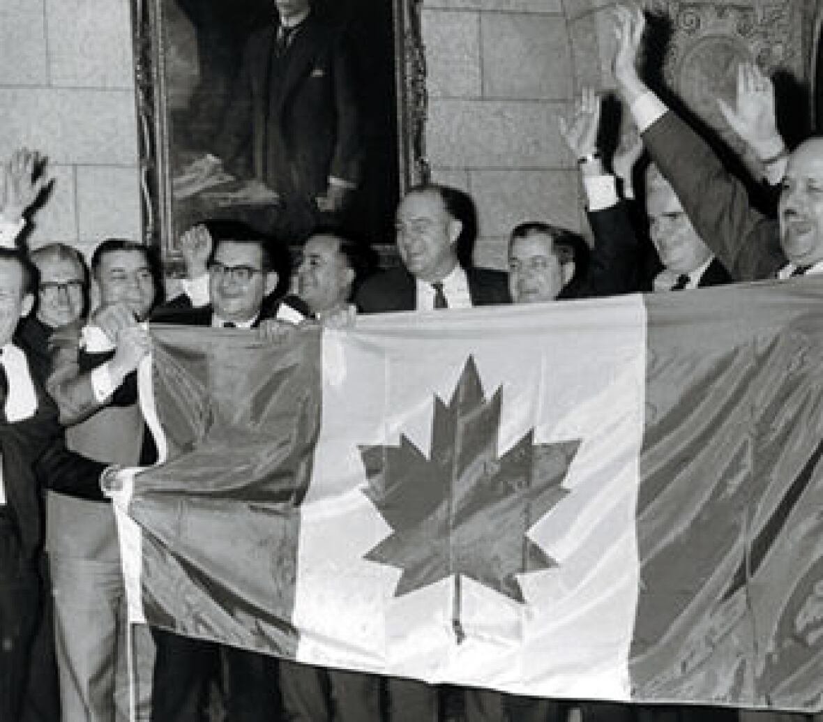 flag-1964 Members of Parliament with new Canadian flag during the flag debate, Ottawa, 1964.