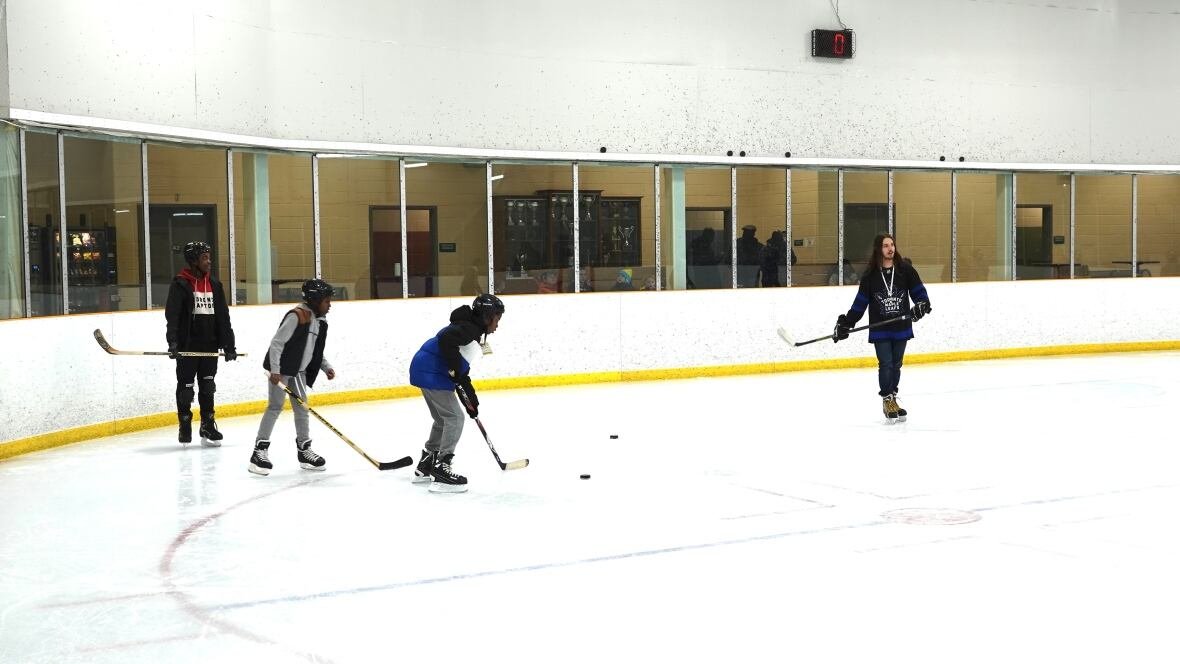 hockey-at-stronach-kilimanjaro A team of volunteer coaches gives free lessons to youth from London's Black community. Kilimanjaro club's founder says its name, derived from Africa's tallest mountain, fits the objective of encouraging kids to reach for the top.