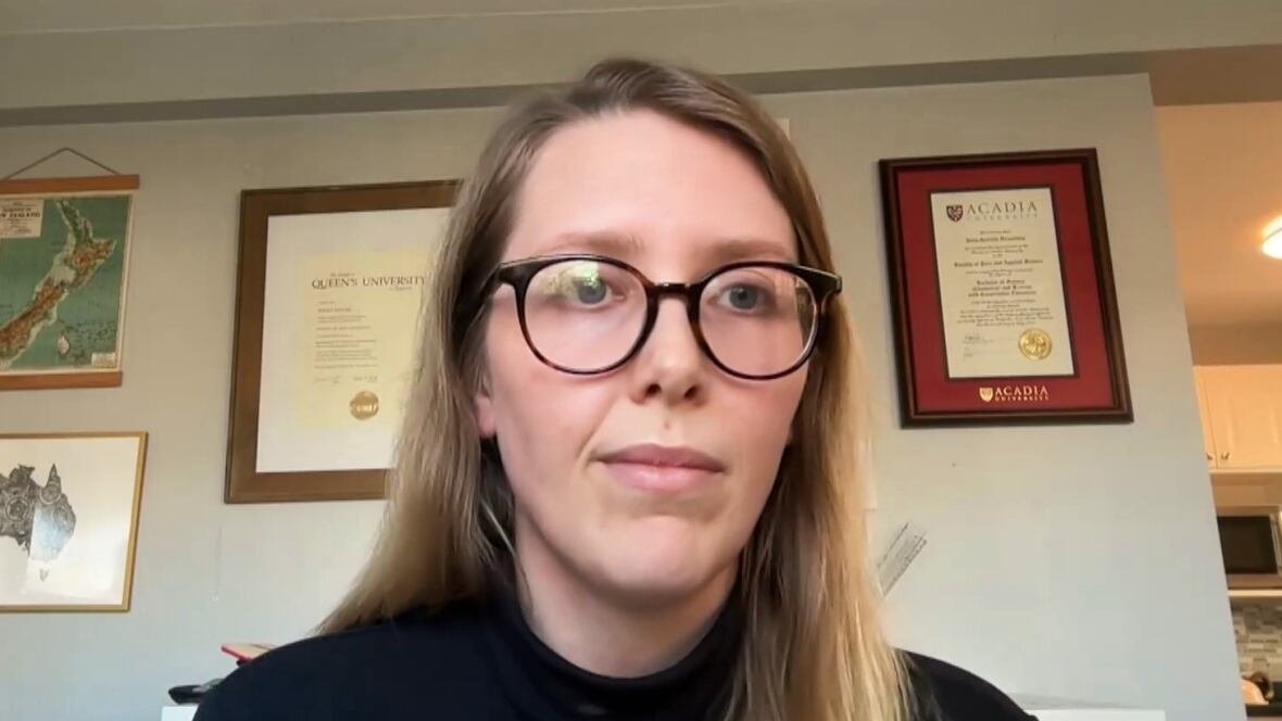 A screen shot of a woman on a video call.