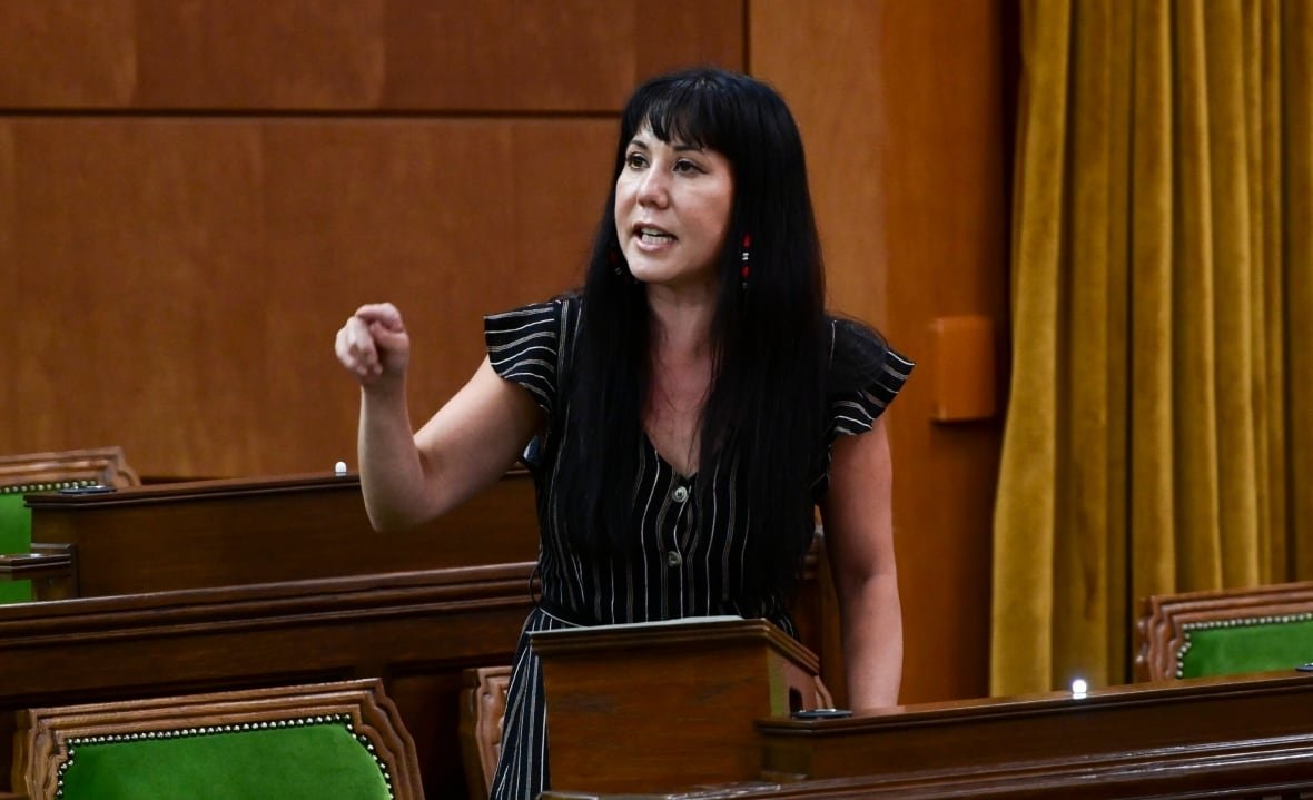 leah-gazan-20210621 A politician points while giving a speech.
