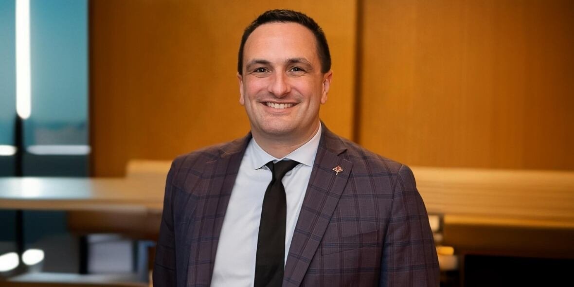 marco-d-angelo-president-and-ceo-canadian-urban-transit-association-july-22-2024 A man in an open suit jacket smiles widely