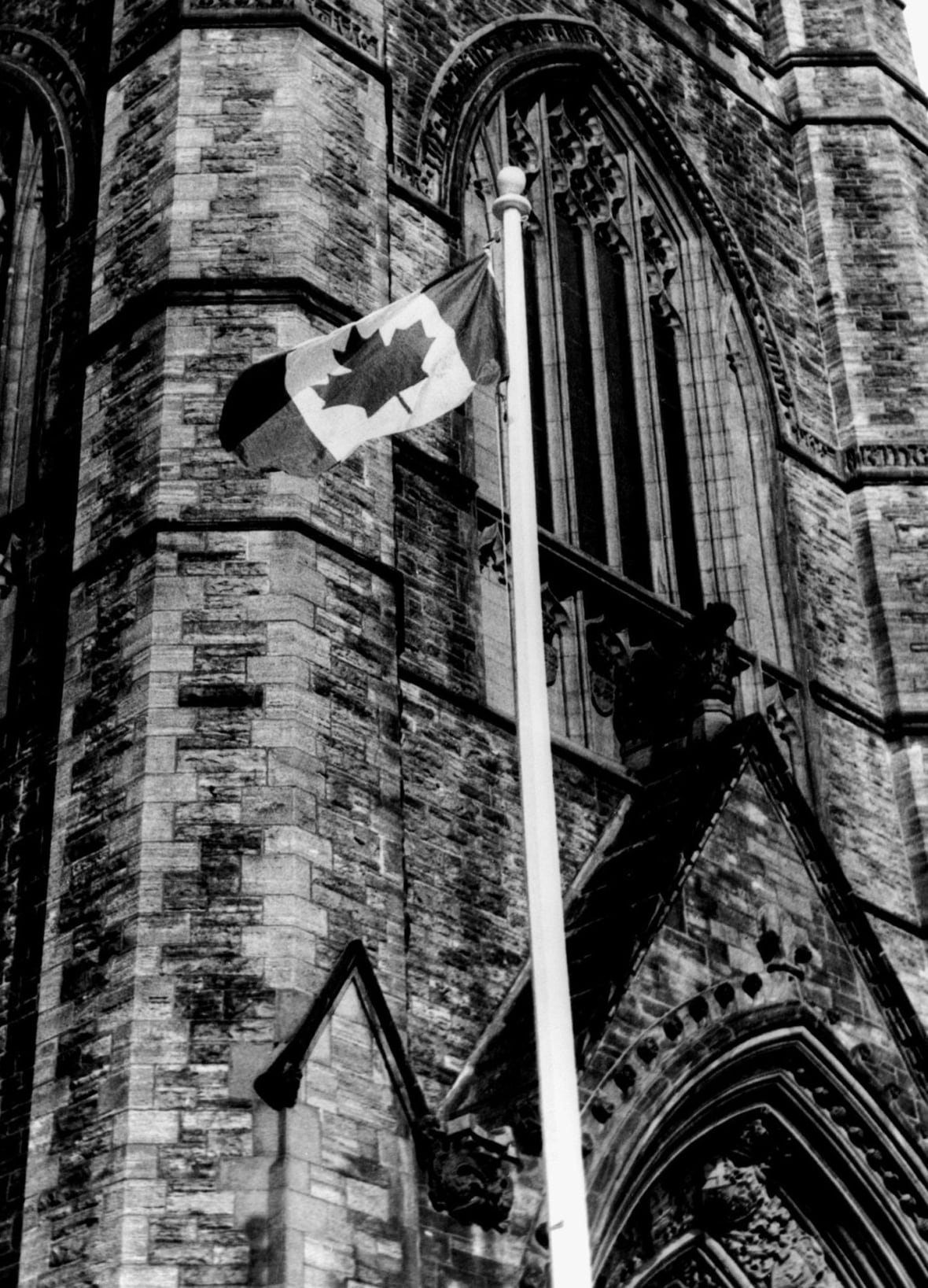 original-flag The Maple Leaf flag flies in front of the Peace Tower on Parliament hill in Ottawa Feb. 15, 1965.