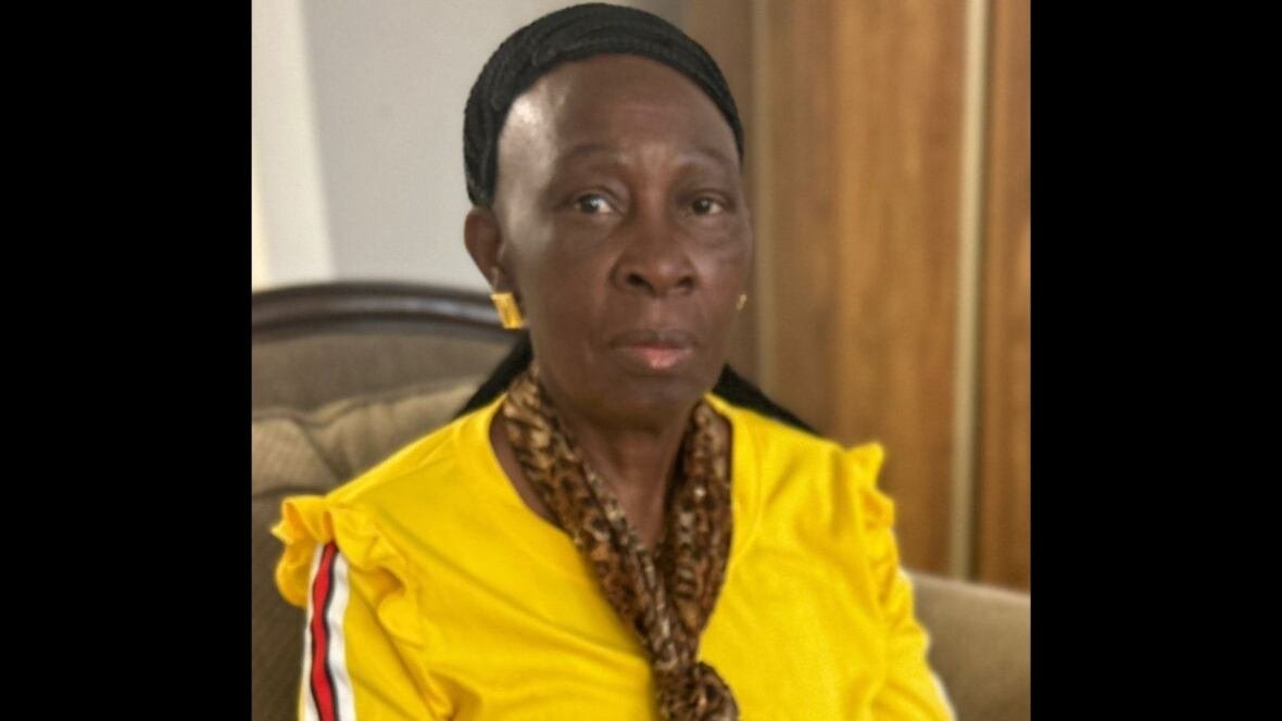 tawembi-portrait A woman in a yellow top.