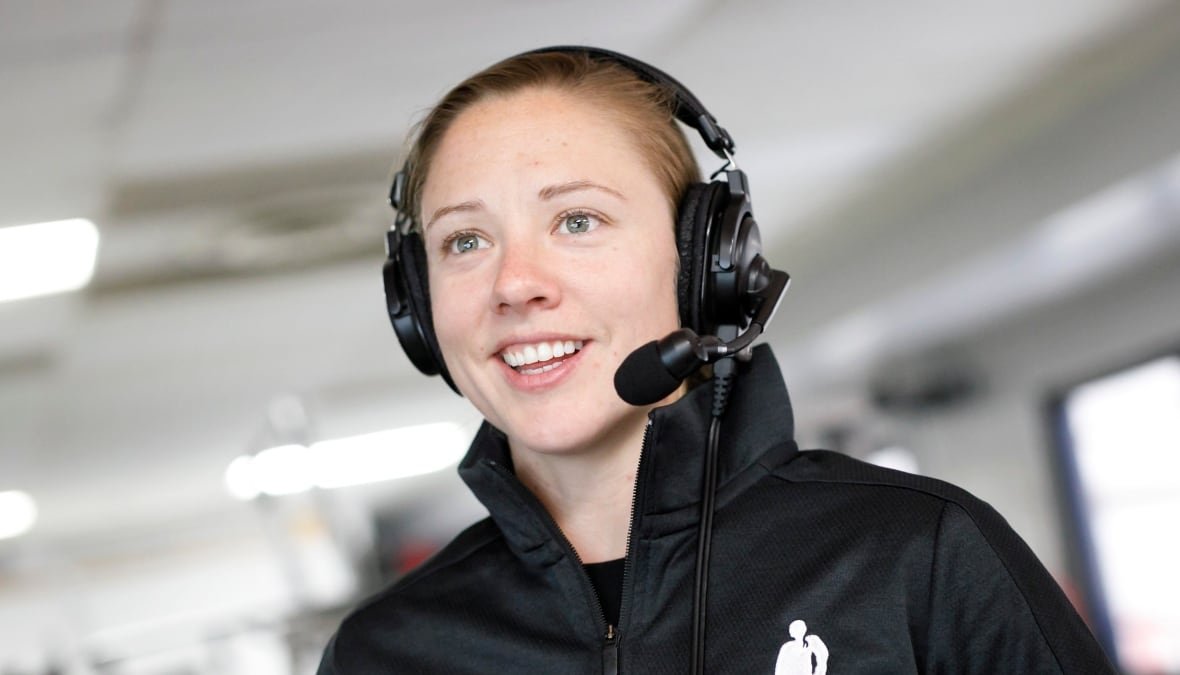 Canadian hockey player Liz Knox is shown in profile as she does commentary for a game at the Unifor Women's Hockey Showcase in Toronto in 2019