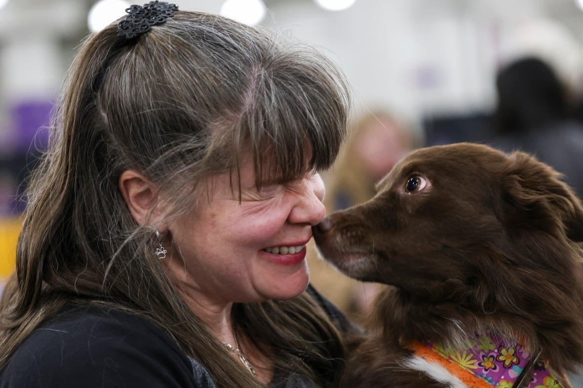 westminster-dog-show-9 A closeup of a woman and her dog rubbing noses during the Westminster Kennel Club dog show.