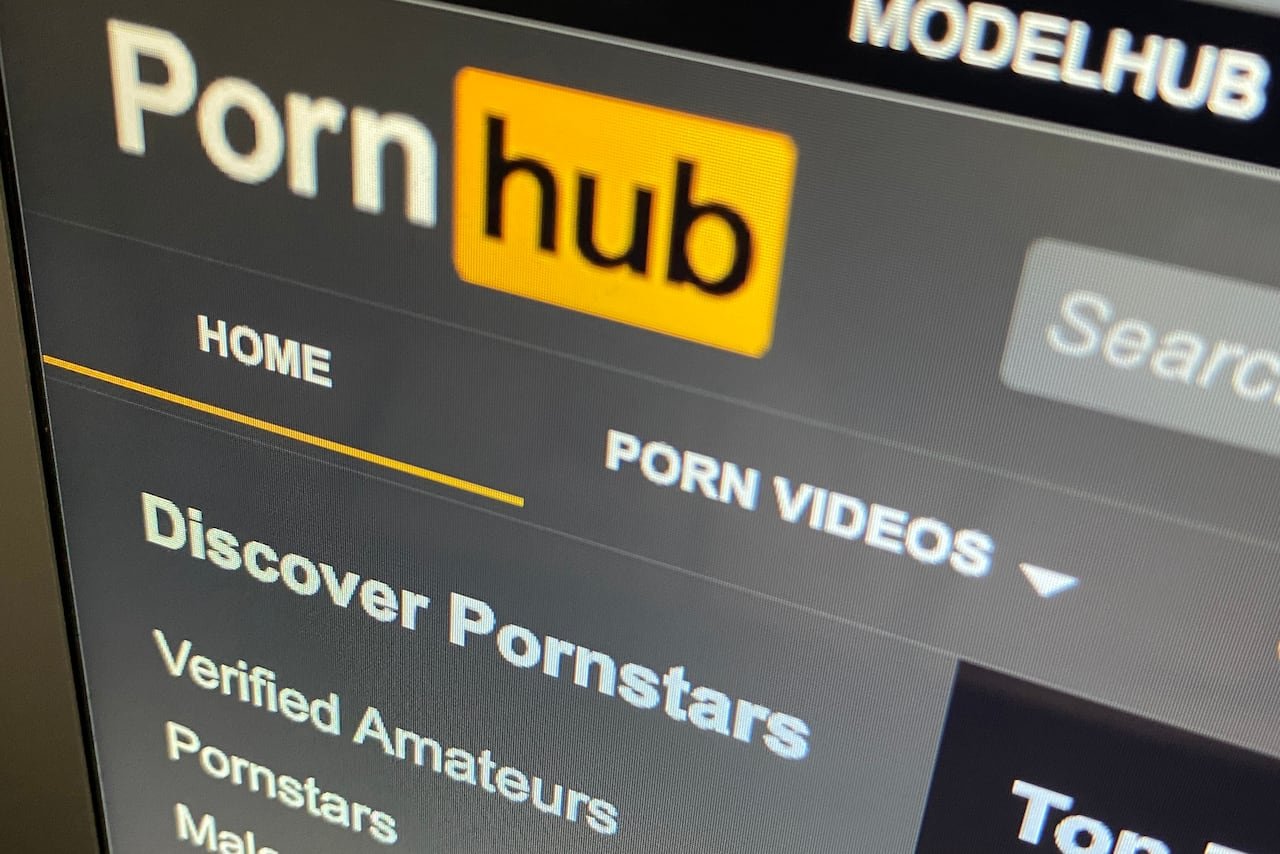 a close-up image of a computer screen showing the pornhub logo and menu options