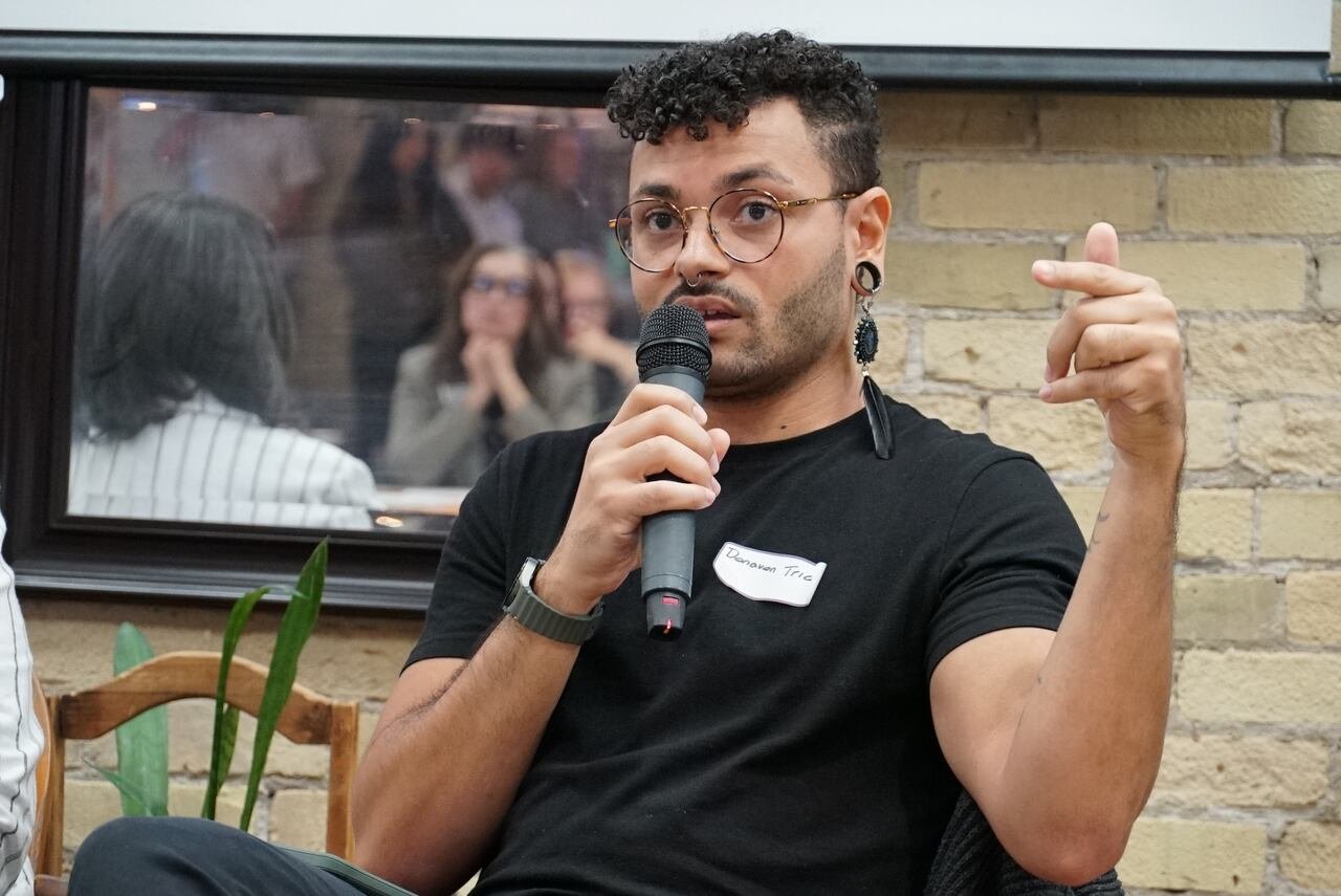 A person speaks into a microphone