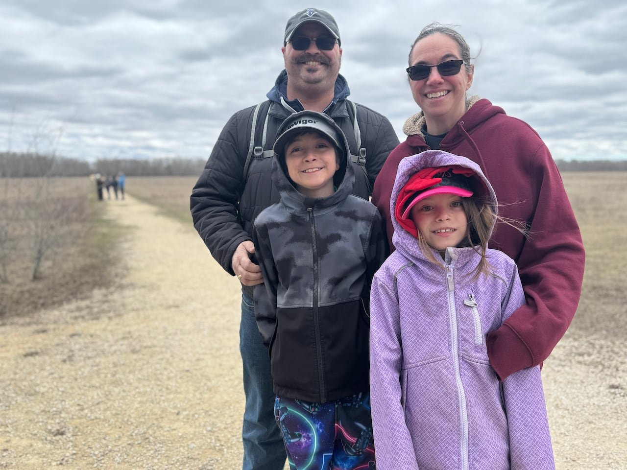 default-488 A woman, a man, and two children on an outdoor trail.