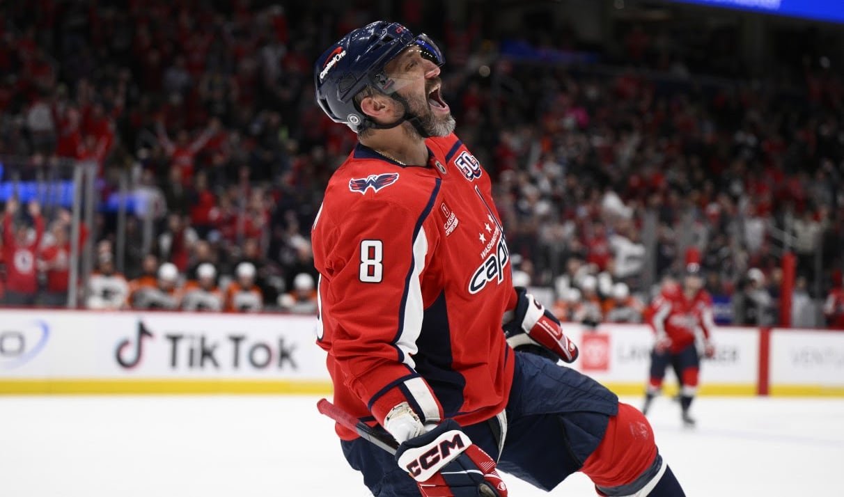 A men's hockey player celebrates.