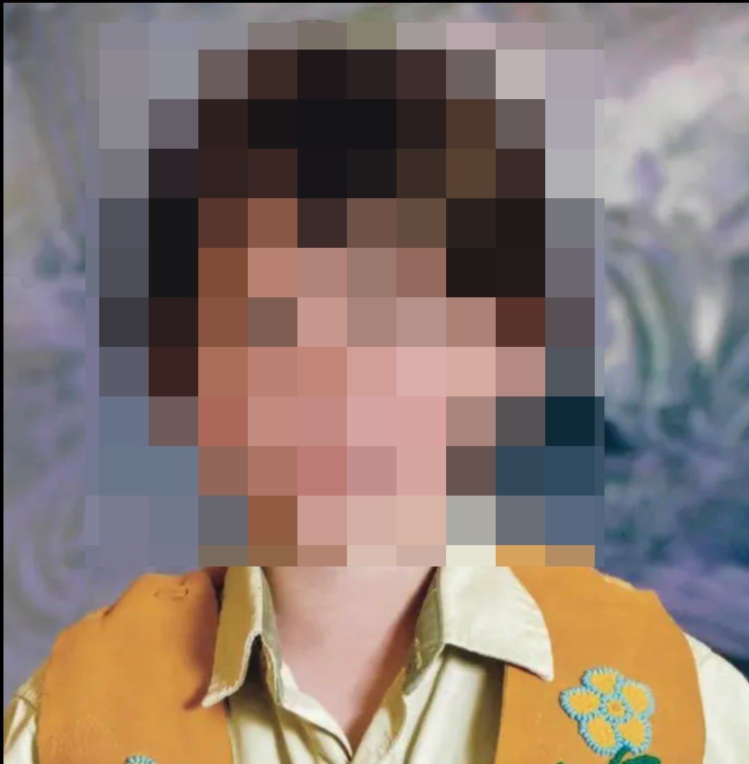 An obscured image of a child.